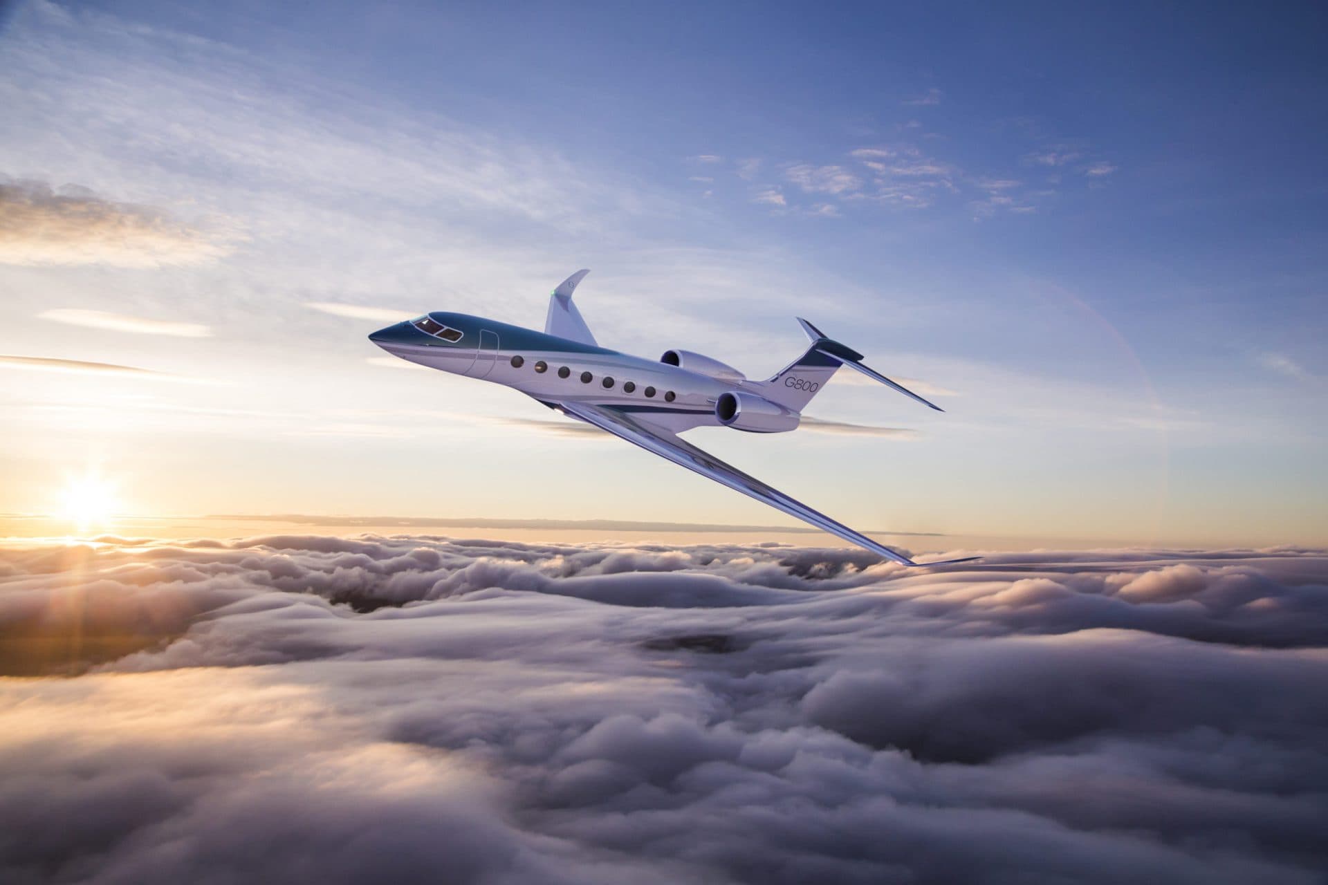 Gulfstream G800 soaring above the clouds at sunset