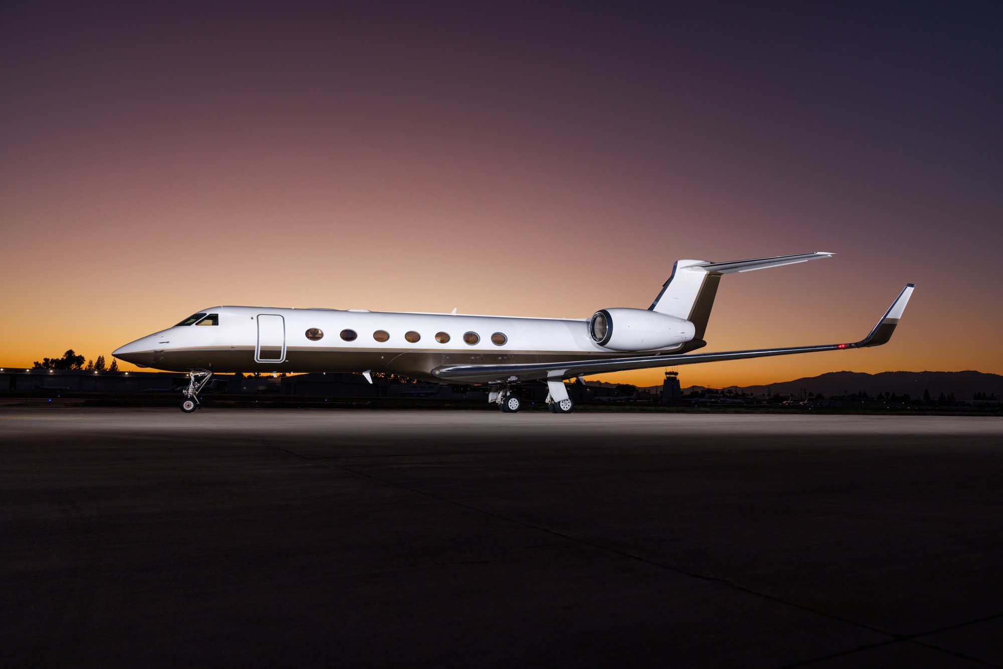 Private jet at sunset